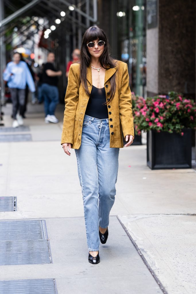 Dakota Johnson street style in Khaite jacket and Levi’s jeans – quiet luxury outfit May 2025
