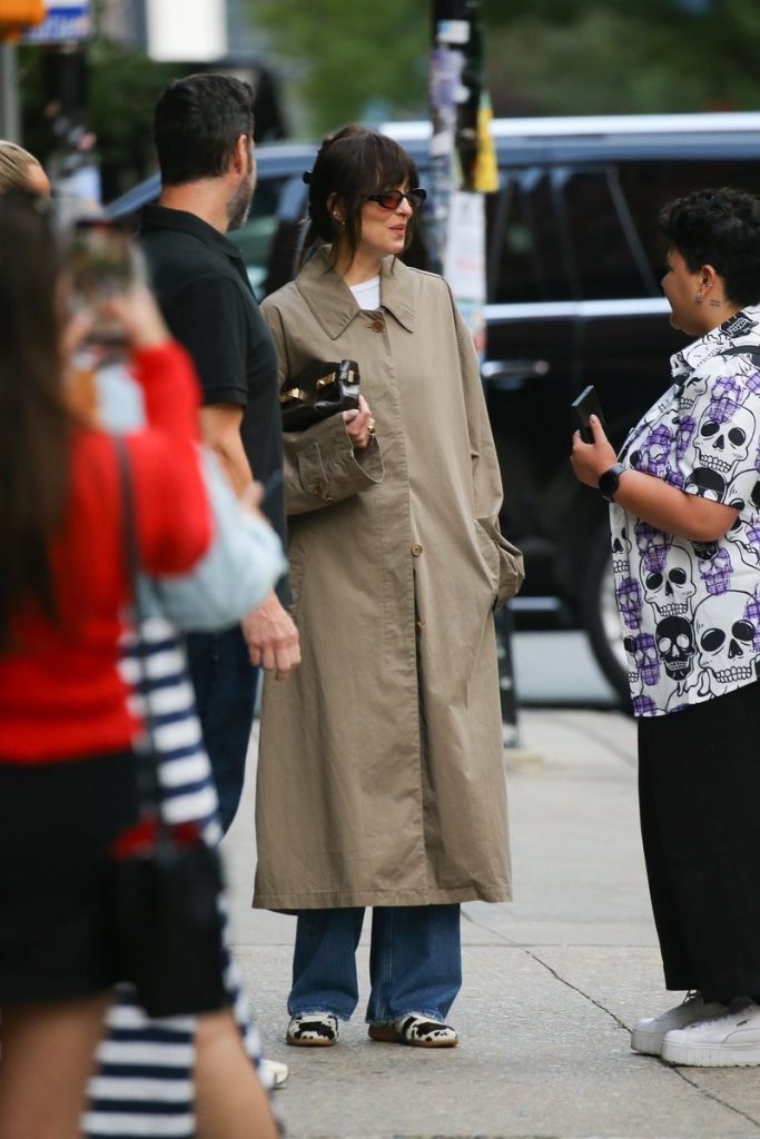 Dakota Johnson minimalist street style in The Row coat and Ferragamo bag – June 2025 outfit