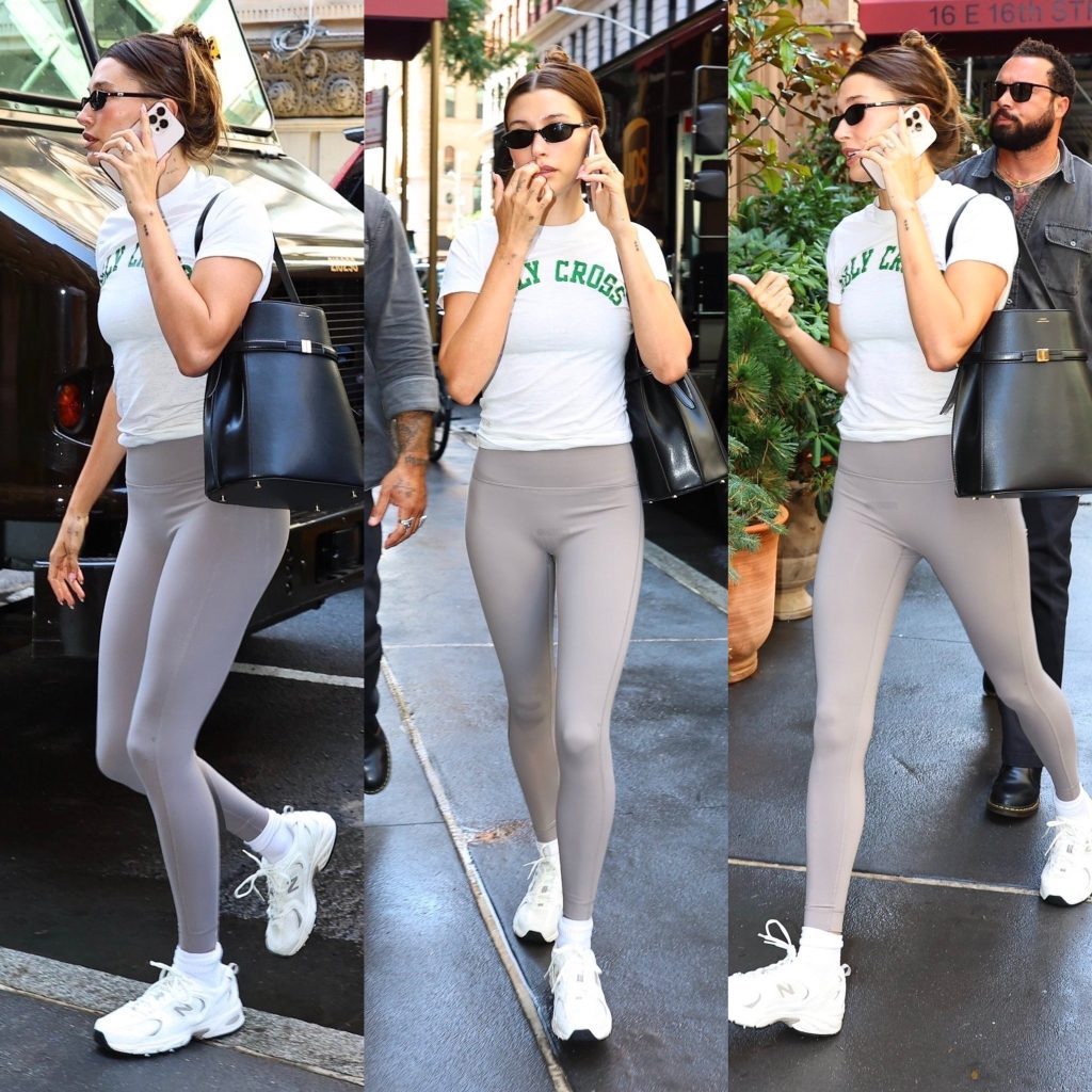 Hailey Bieber’s sporty minimalist look with Toteme belt leather bucket bag and New Balance 530 sneakers – dress like Hailey Bieber 2025